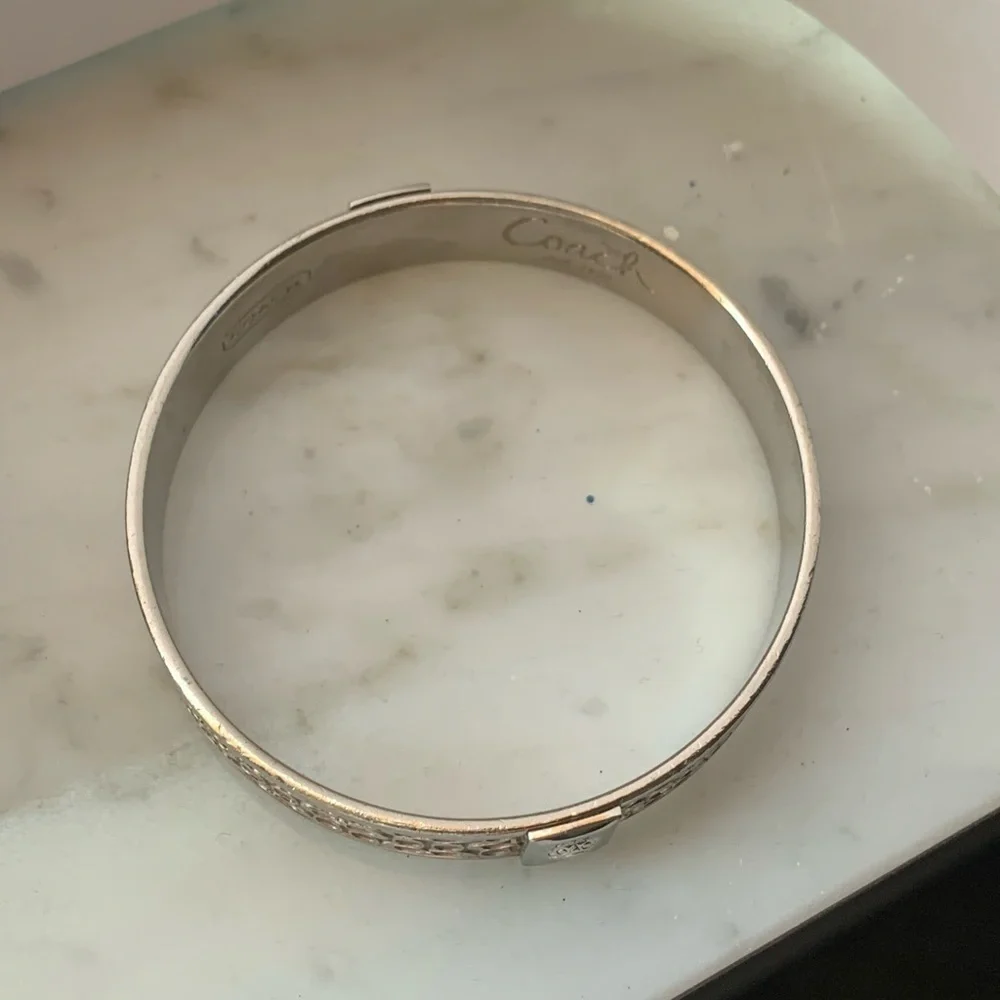 Coach Signature silver bracelet for women. Authentic